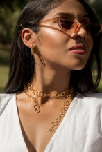 Load image into Gallery viewer, Model wearing Enso Necklace with Oblong Earrings.
