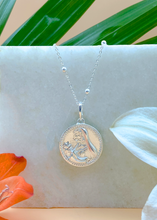 Load image into Gallery viewer, Silver Modern Maharani Pendant on white marble slab with leaves and flowers