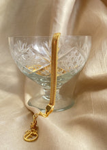 Load image into Gallery viewer, Adira bracelet in an ice cream bowl over a golden background with Erus logo