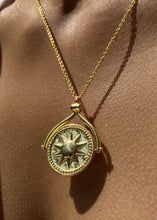 Load image into Gallery viewer, Rotating sun and moon pendant facing sun side.