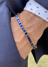 Load image into Gallery viewer, Male model wearing sapphire square cut tennis bracelet