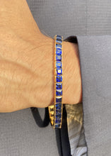 Load image into Gallery viewer, Male model wearing sapphire square cut tennis bracelet