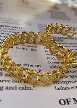 Load image into Gallery viewer, Aphrodite earrings on magazine