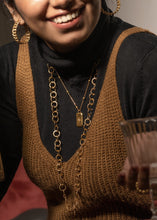 Load image into Gallery viewer, Model wearing round circle enso necklace, star carved Celeste pendant and hoop earrings