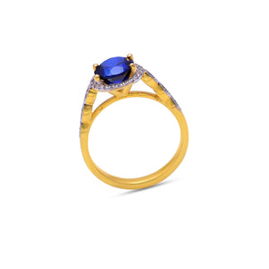 Blue sapphire halo ring in gold