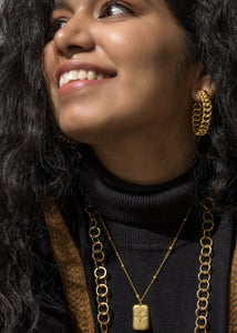 Model wearing Bold Aphrodite earrings and necklaces