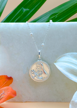 Load image into Gallery viewer, Silver Modern Maharani Pendant on white marble slab with leaves and flowers
