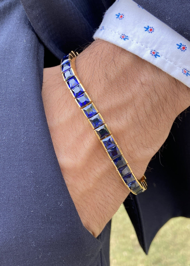 Male model wearing sapphire square cut tennis bracelet 