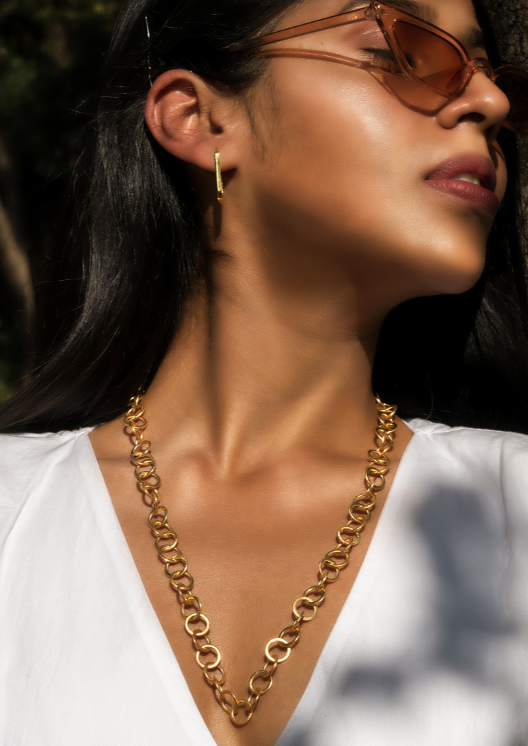 Model wearing Enso necklace and Oblong Earrings with shades